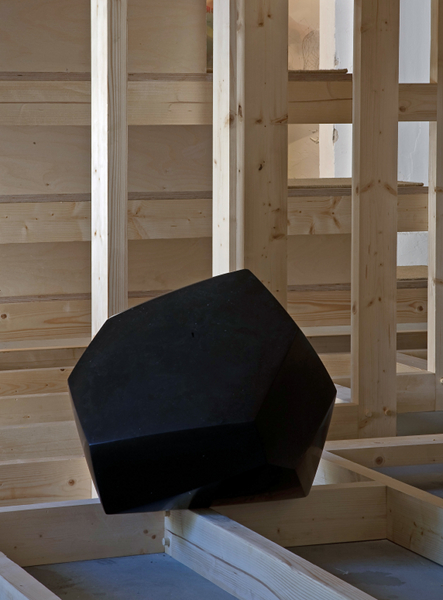  photograph - Kilkenny limestone sculpture - in wooden structure, -hedra - Jason Ellis - part of installation by dePaor Architects - 12th Venice Architecture Biennale - 2010 - image credit: Alice Clancy